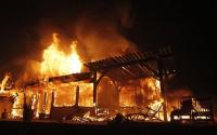 A large Spanish style estate home burns, ignited by a wind driven brush fire dubbed the "Tea Fire" in Montecito, Calif. on Thursday, Nov. 13, 2008. (AP Photo/Dan Steinberg)