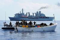 epa03156232 (FILE) A file handout photograph released on 01 December 2011 by the British Ministry of Defence shows a boarding team from the British Royal Navy  Royal Fleet Auxiliary (RFA), combined fleet stores ship and tanker, RFA Fort Victoria searching a pirate whaler, with Fort Victoria visable in the background, after receiving information that a Spanish fishing vessel operating to the north of their position had come under attack from a group of pirate vessels, in the Indian Ocean, 28 November 2011. Media reports on 23 March 2012 state that the European Union (EU) has agreed to expand its military mission against Somali pirates, by allowing EU forces attack bases on land as well as pirates at sea.  EPA/LA(PHOT) DAVE JENKINS / BRITISH MANDATORY CREDIT: CROWN COPYRIGHT HANDOUT EDITORIAL USE ONLY/NO SALES HANDOUT EDITORIAL USE ONLY/NO SALES
